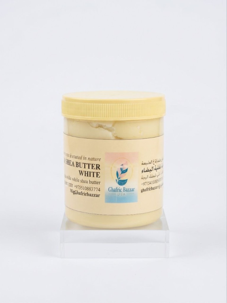 White shea butter in a yellow tub